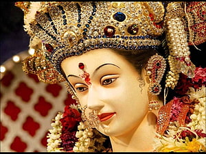Ornate Maa Durga Idol Adorned With Jeweled Crown And Floral Garlands HD wallpaper