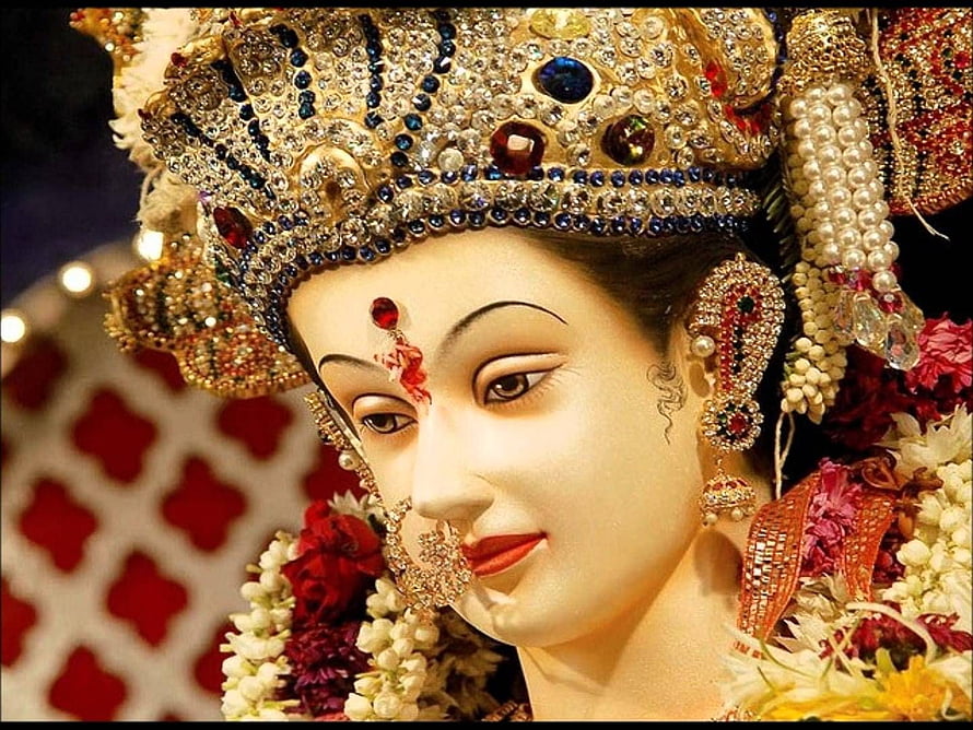 Ornate Maa Durga Idol Adorned With Jeweled Crown And Floral Garlands HD wallpaper