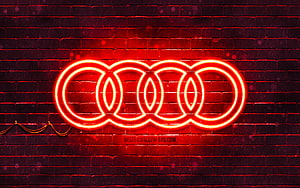 Audi four rings neon sign glowing red on dark brick wall HD wallpaper
