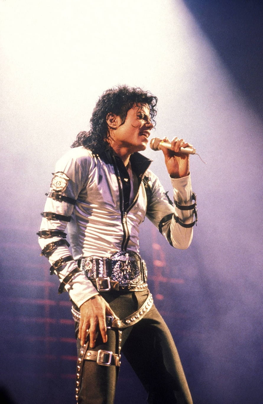 Michael Jackson performing on stage in white leather jacket and studded belt during the Bad Tour HD phone wallpaper