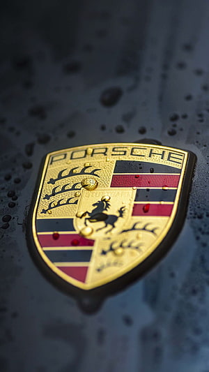 Porsche Emblem Close-Up on Wet Dark Car Surface with Water Droplets HD phone wallpaper