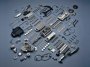 Complete Automotive Engine Components Arranged in a Technical Flat Lay HD wallpaper
