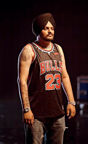 Sidhu Moosewala in Black Bulls Jersey and Turban on Stage HD phone wallpaper