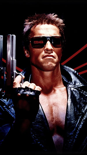 Arnold Schwarzenegger as the Terminator in a black leather jacket holding a pistol with dark sunglasses HD phone wallpaper