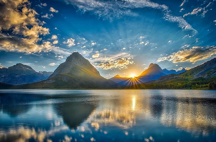 Sunset Reflections on a Mountain Lake with Dramatic Clouds and Golden Light HD wallpaper