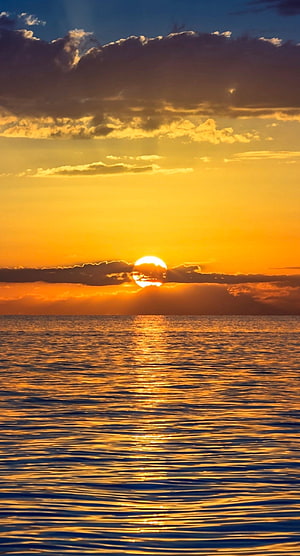 Golden Ocean Sunset with Dramatic Clouds and Sun Reflection on Water HD phone wallpaper