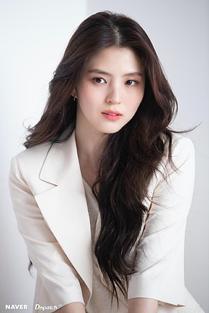 Han So Hee in a Cream Blazer with Long Wavy Hair HD phone wallpaper