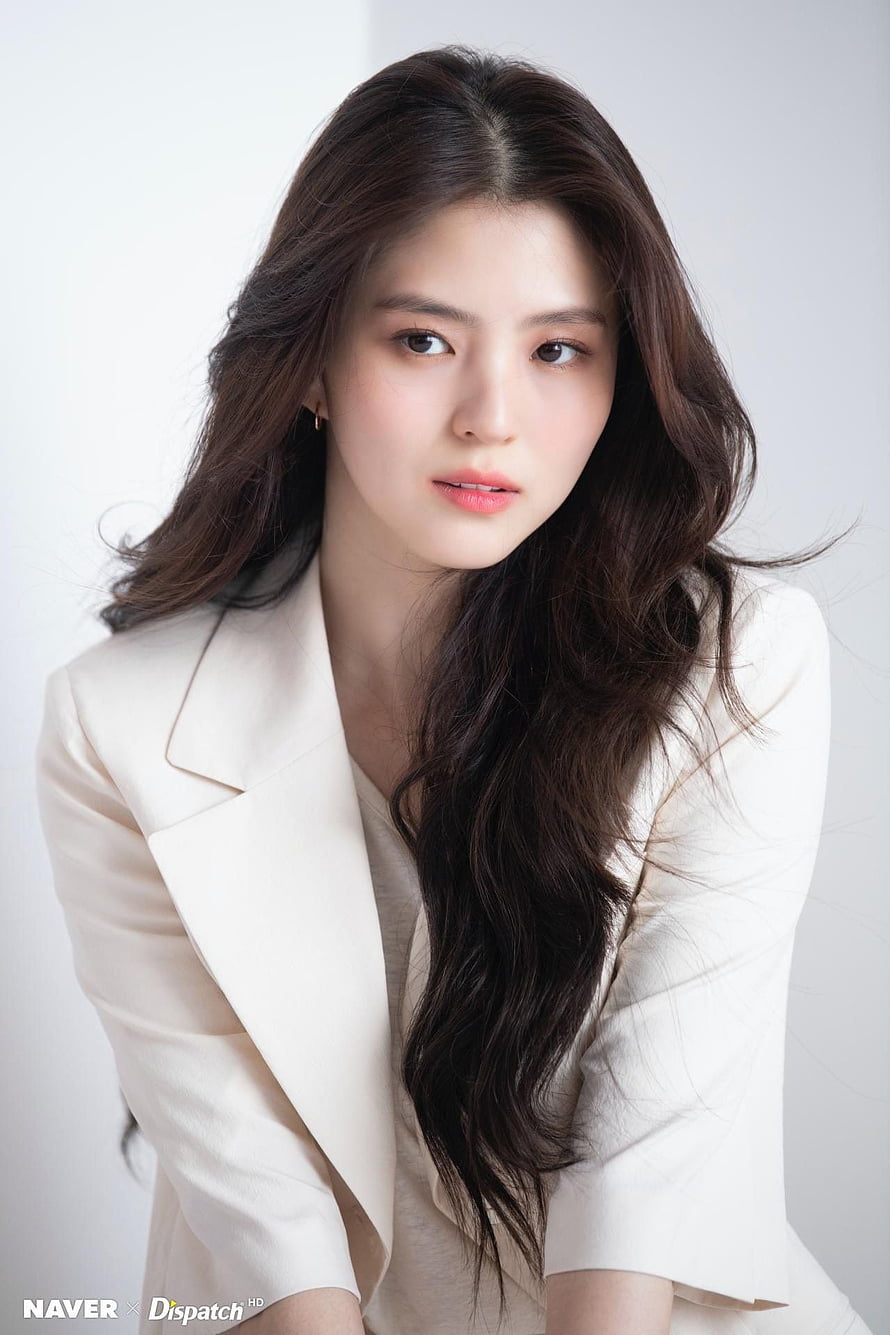 Han So Hee in a Cream Blazer with Long Wavy Hair HD phone wallpaper