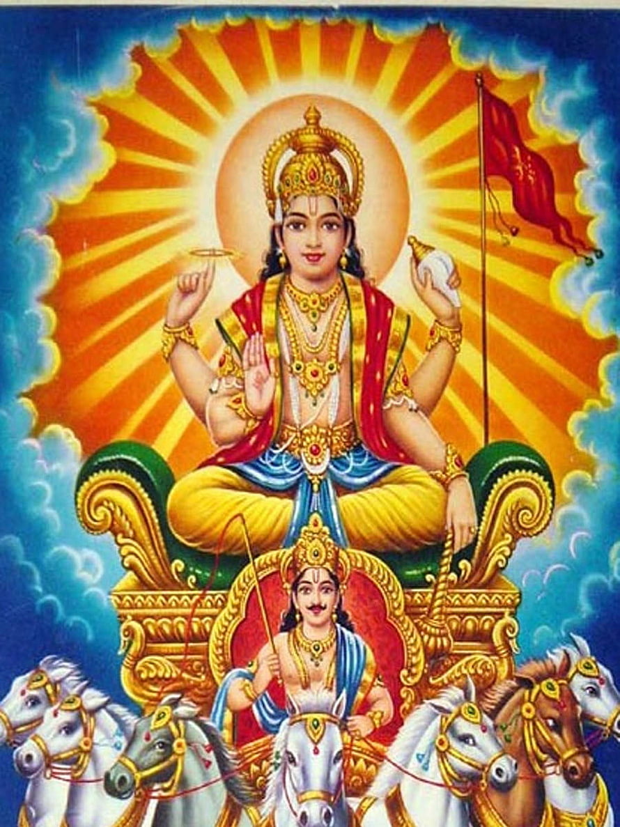 Lord Surya Dev seated on the seven-horse chariot with radiant sun halo and traditional Indian deity art HD phone wallpaper