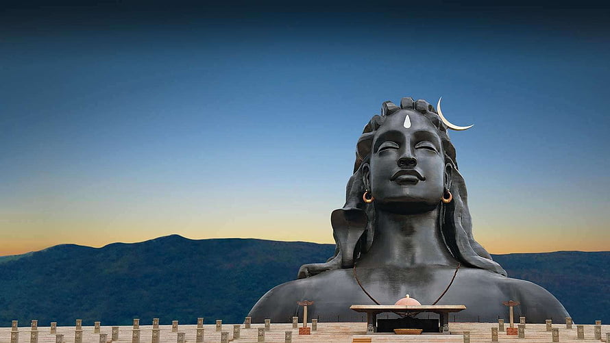 Shiva Statue at Isha Foundation with Crescent Moon and Mountain Backdrop HD wallpaper