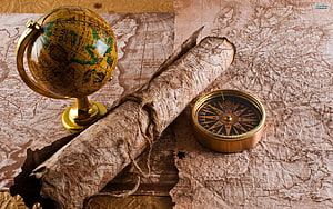 Vintage Travel Still Life With Antique Globe, Rolled Map, and Brass Compass on Aged Paper HD wallpaper