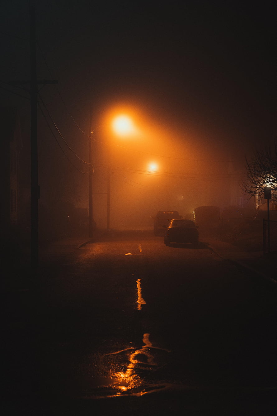 Moody Night Street Scene with Foggy Streetlights and Wet Road Reflections HD phone wallpaper