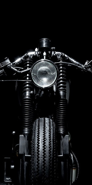 Front View of a Classic Cafe Racer Motorcycle with Headlight and Front Wheel HD phone wallpaper