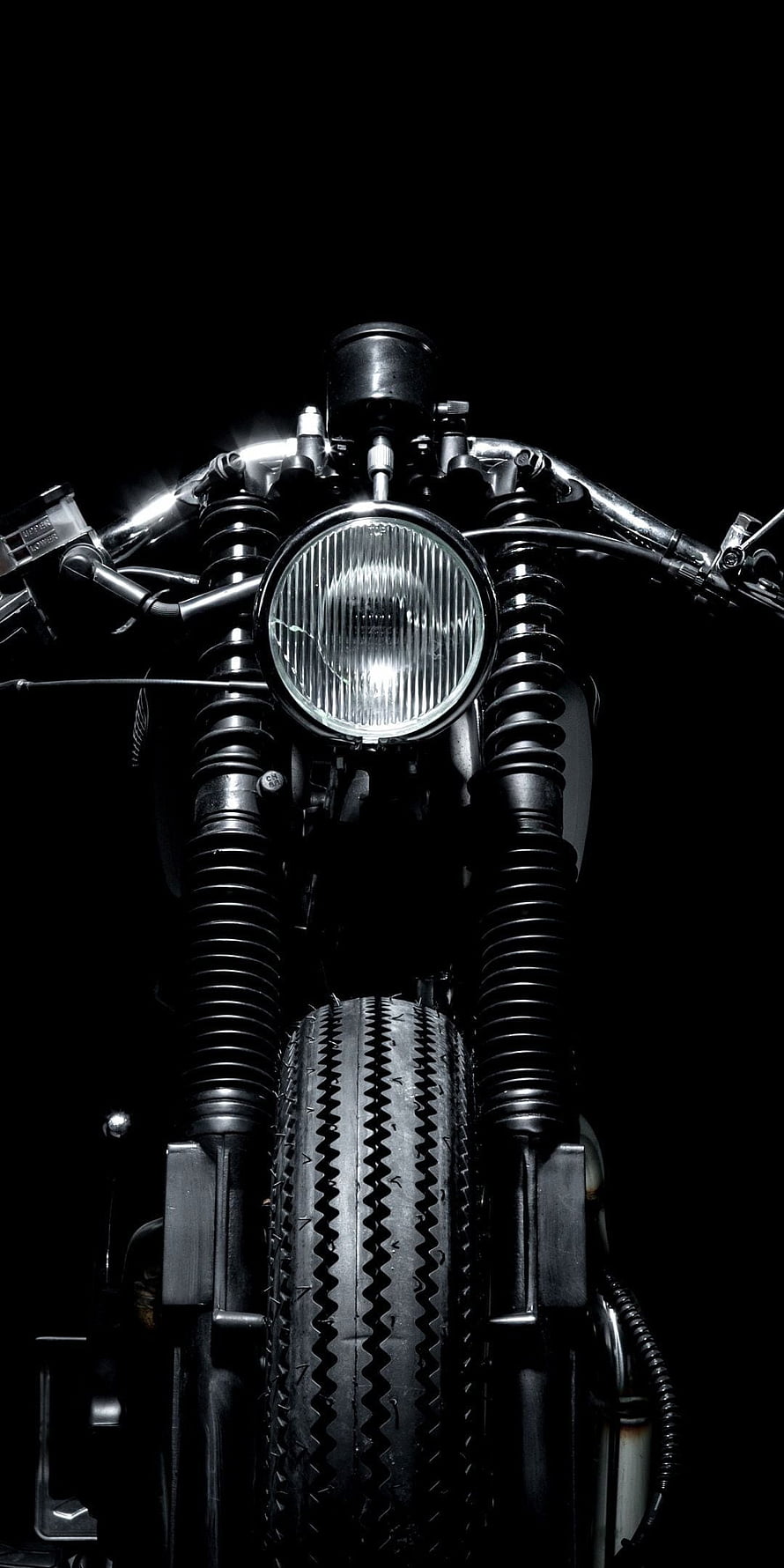 Front View of a Classic Cafe Racer Motorcycle with Headlight and Front Wheel HD phone wallpaper