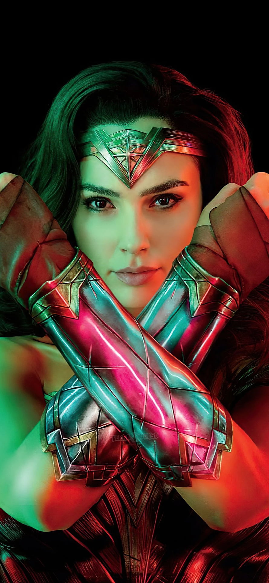 Gal Gadot as Wonder Woman in Dramatic Red and Green Lighting with Crossed Arms HD phone wallpaper