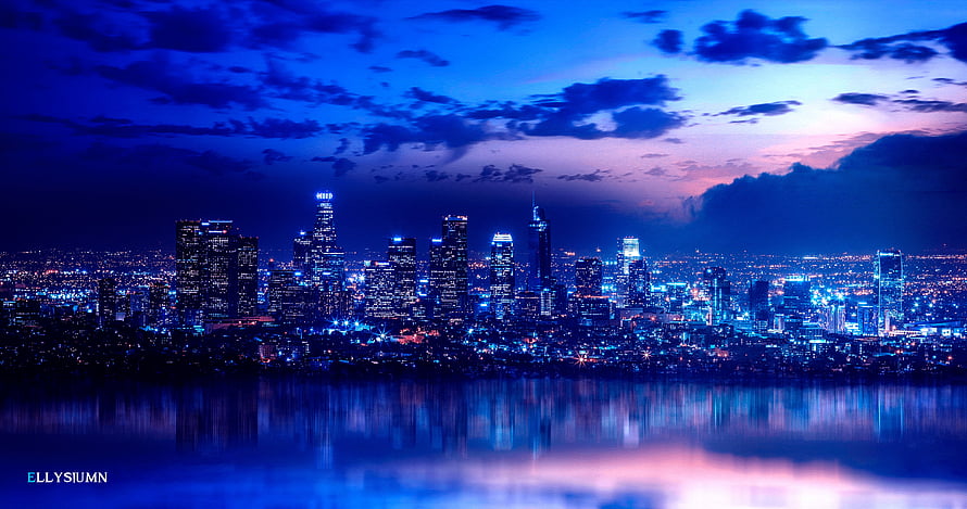Downtown skyline at twilight with deep blue sky and city lights reflected in the water HD wallpaper