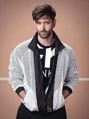 Hrithik Roshan in a white mesh jacket and black graphic tee studio portrait HD phone wallpaper