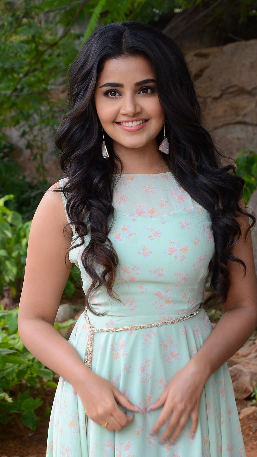 Anupama in a mint green floral dress with long wavy hair and gold earrings HD phone wallpaper
