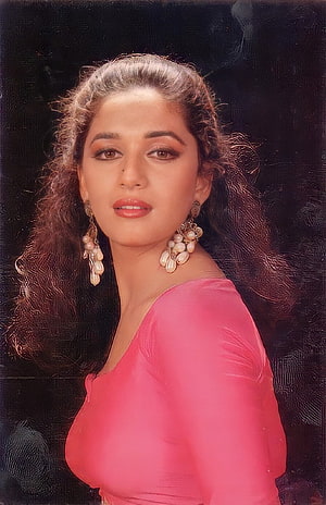 Madhuri Dixit in a pink sari with pearl earrings and voluminous curls HD phone wallpaper