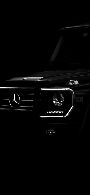 Mercedes-AMG G63 Front Grille and Headlight Close-Up in Dark Studio Lighting HD phone wallpaper
