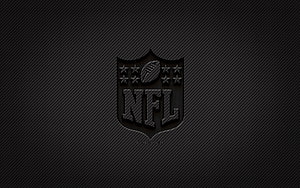 NFL Shield Emblem on Dark Carbon Fiber Texture with Grunge Finish HD wallpaper