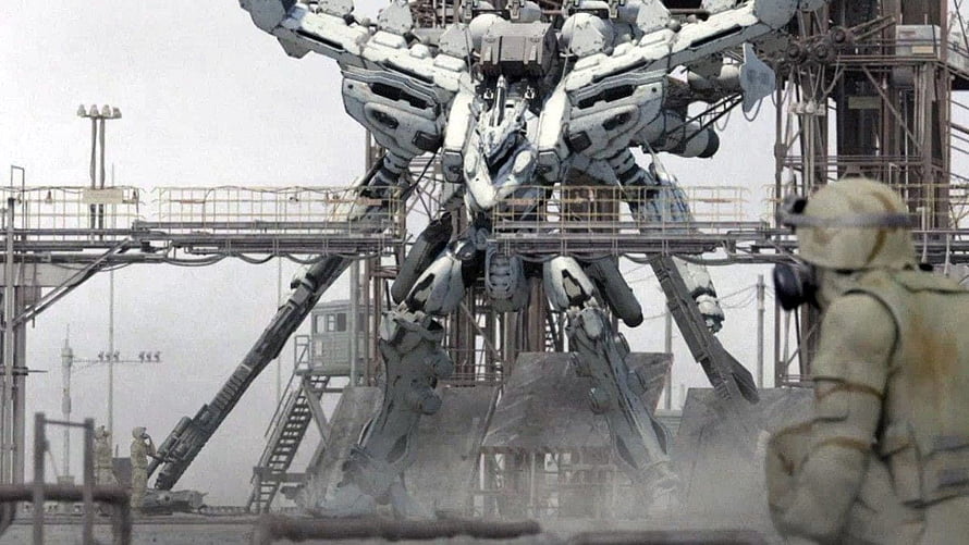 Armored Core Mecha Standing in Industrial Facility with Soldier in Foreground HD wallpaper