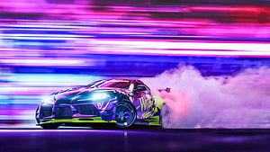 Toyota Supra Drift Car with Neon Purple and Pink Light Trails at Night HD wallpaper