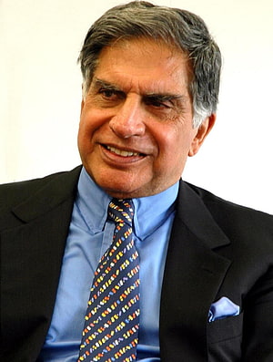 Ratan Tata in a black suit with a blue shirt and colorful patterned tie HD phone wallpaper