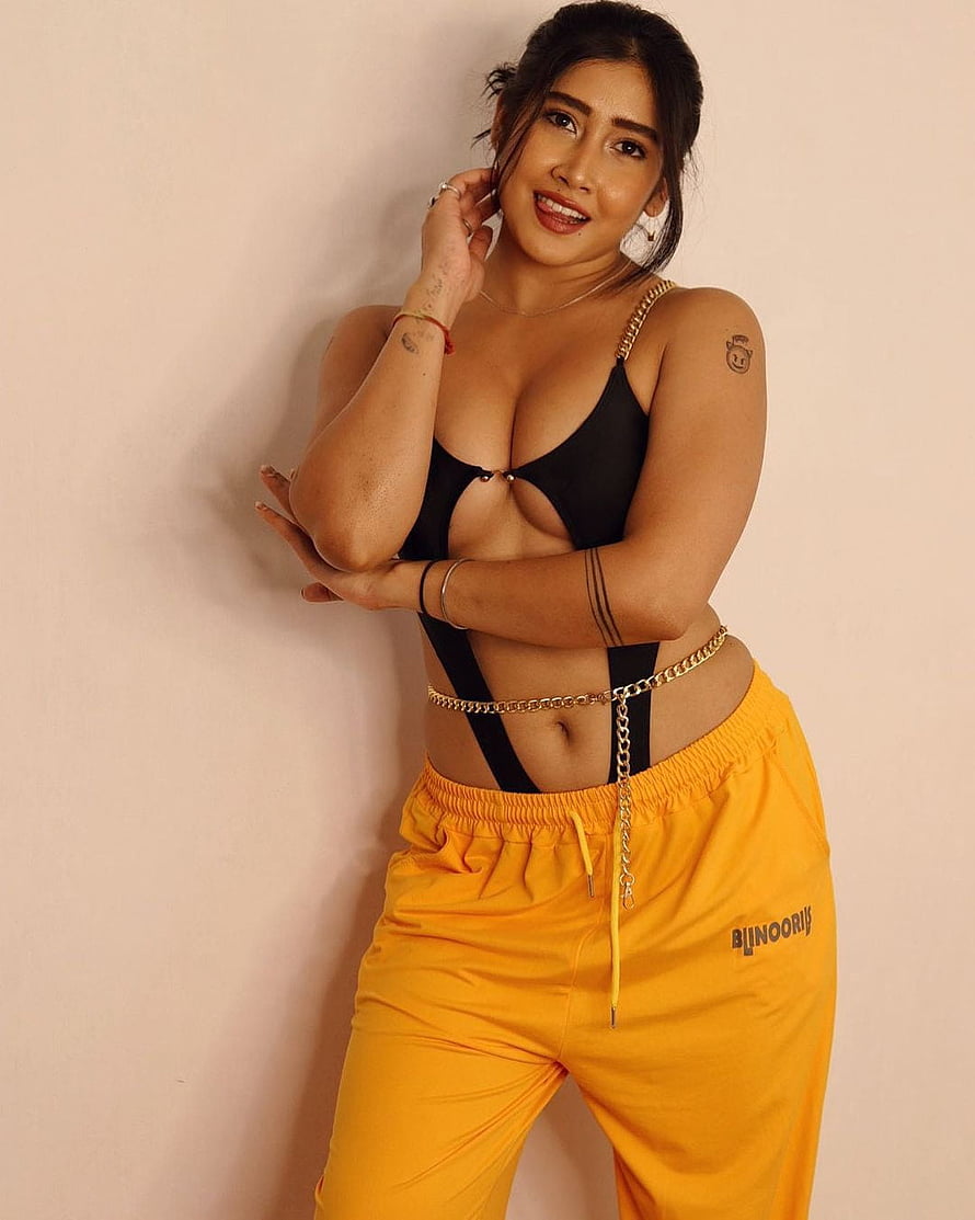 Sofia Ansari in Black Cutout Top and Yellow Joggers HD phone wallpaper