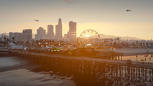 Grand Theft Auto 5 Los Santos Pier at Golden Hour with Ferris Wheel and Helicopters HD wallpaper