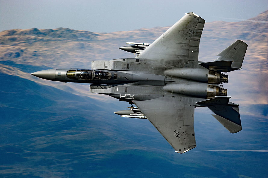 McDonnell Douglas F-15 Eagle Fighter Jet in Flight Over Mountainous Terrain HD wallpaper