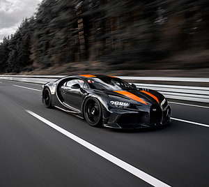 Black Bugatti Chiron Sport with Orange Stripes Speeding on a Highway HD wallpaper