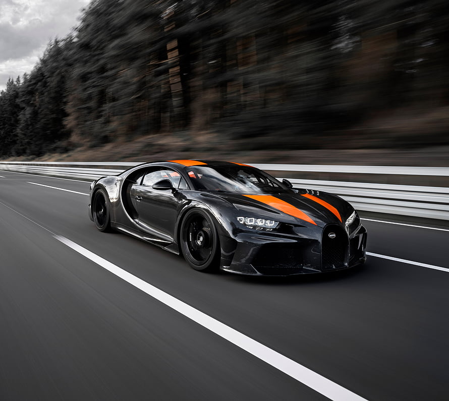 Black Bugatti Chiron Sport with Orange Stripes Speeding on a Highway HD wallpaper