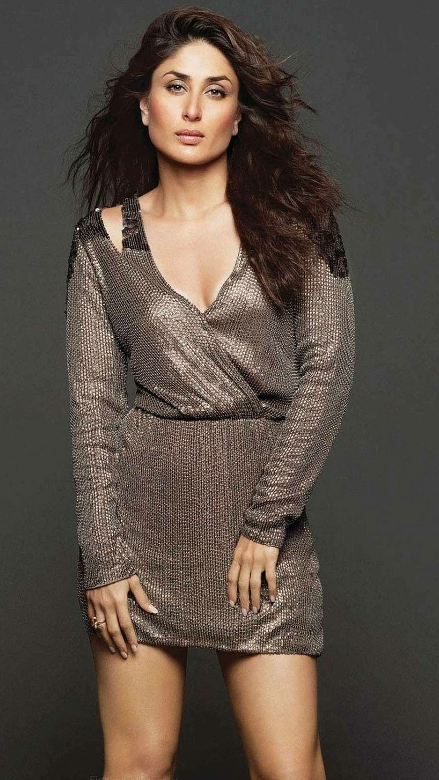 Kareena Kapoor in a shimmering metallic wrap dress with long sleeves and flowing dark hair HD phone wallpaper