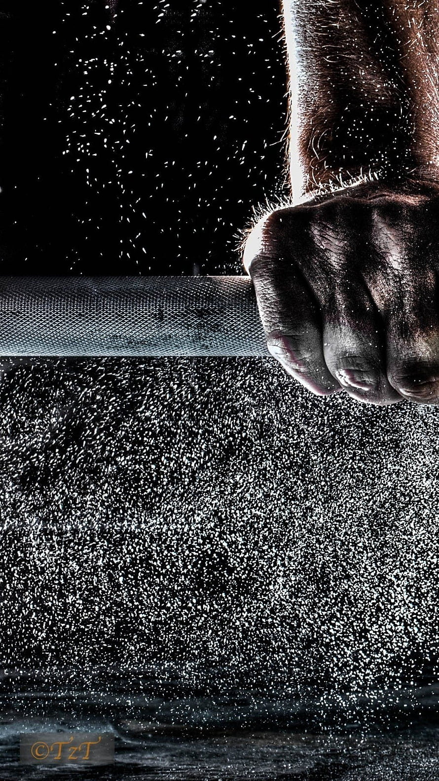 Gripping Hand on Weightlifting Bar with Flying Chalk Dust in Dark Gym HD phone wallpaper