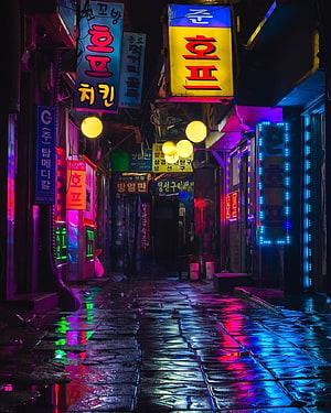 Rainy Night in Seoul: Neon-Lit Korean Street with Cyberpunk Atmosphere HD phone wallpaper
