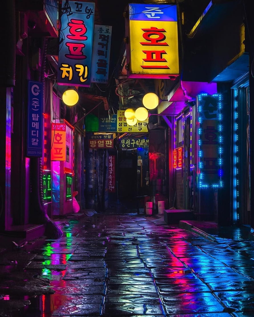 Rainy Night in Seoul: Neon-Lit Korean Street with Cyberpunk Atmosphere HD phone wallpaper