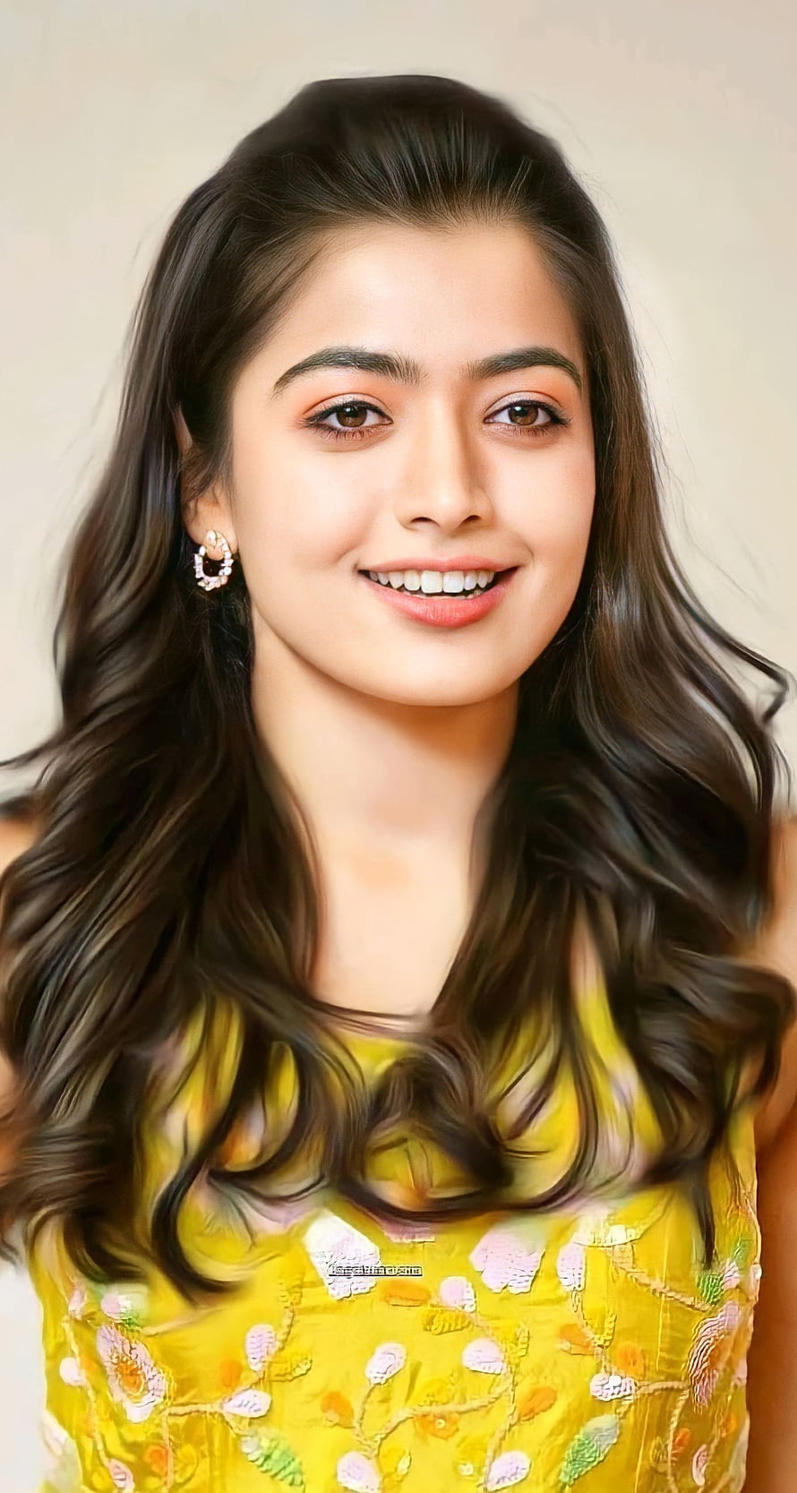 Rashmika Mandanna smiling portrait in yellow floral embroidered top with long wavy hair HD phone wallpaper