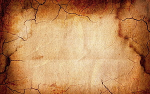 Aged Cracked Parchment Texture with Rustic Brown Stains and Weathered Surface Details HD wallpaper