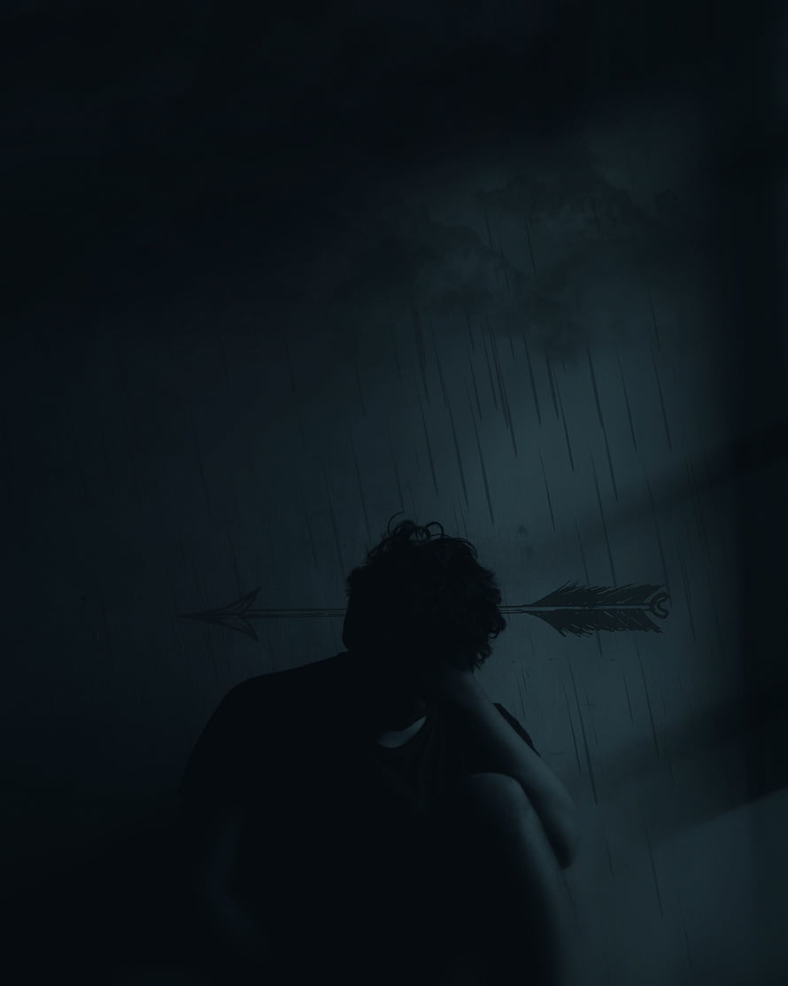 Silhouette of a person sitting alone in the rain with an arrow symbol on the wall HD phone wallpaper