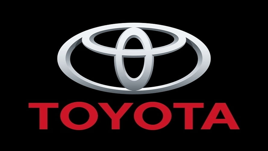 Toyota Brand Emblem with Red Wordmark on Black Background HD wallpaper