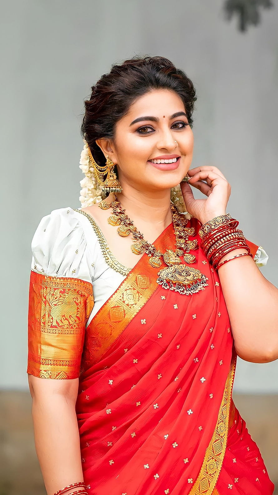 Sneha Tamil Actress in Traditional Red Saree with Gold Jewelry and Floral Hairpiece HD phone wallpaper