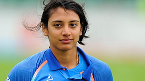 Smriti Mandhana in Blue Cricket Jersey Portrait HD wallpaper