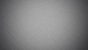 Minimalist Grey Gradient Texture with Subtle Vignette and Fine Grain HD wallpaper