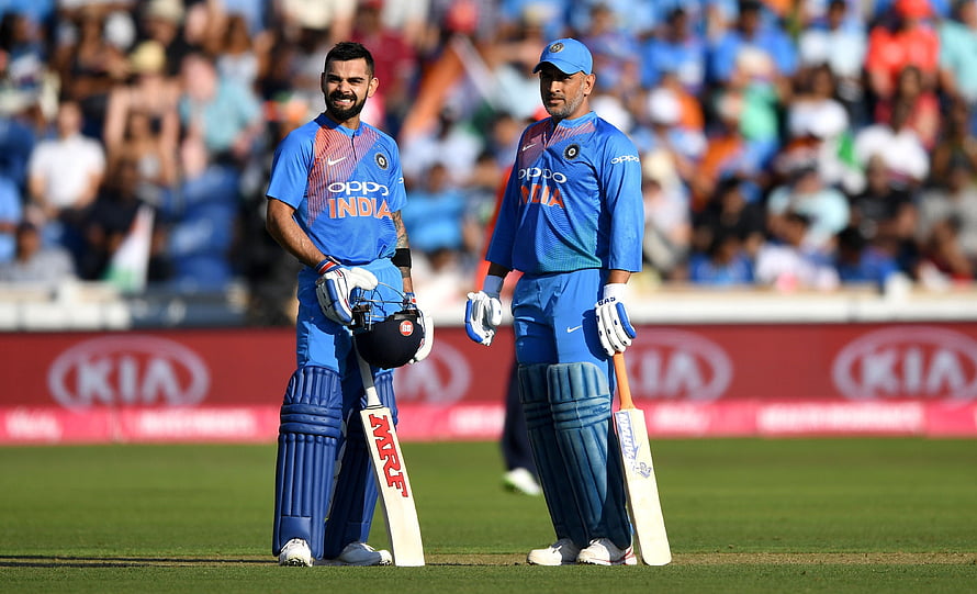 Virat Kohli and MS Dhoni in India Cricket Blue ODI Uniforms on the Field HD wallpaper