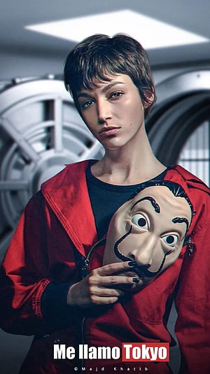 Money Heist Tokyo promotional portrait of a woman in a red jumpsuit holding a Dalí mask HD phone wallpaper