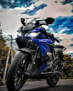 Yamaha R15 V3 Blue Sport Motorcycle on Open Road Under Dramatic Sky HD phone wallpaper