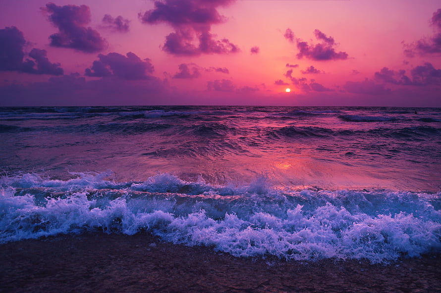 Vibrant Pink Ocean Sunset With Breaking Waves And Dramatic Clouds HD wallpaper