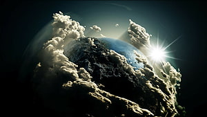 Dramatic Planet Viewed From Space With Billowing Clouds And Bright Sun Flare HD wallpaper