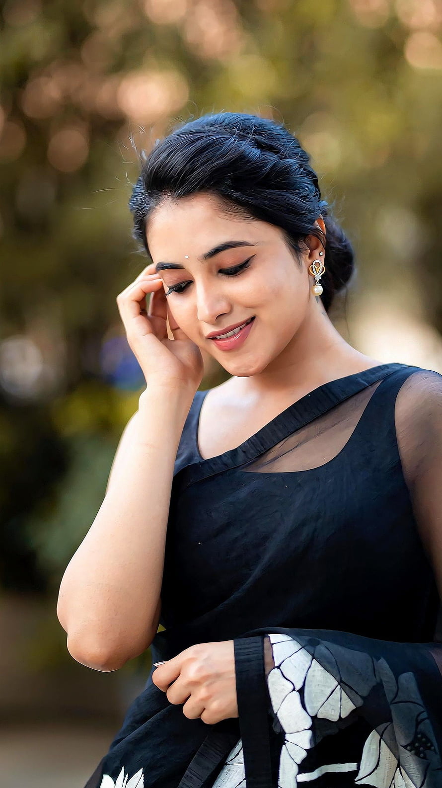 Priyanka Mohan in Elegant Black Saree with Floral Pattern and Pearl Earrings HD phone wallpaper